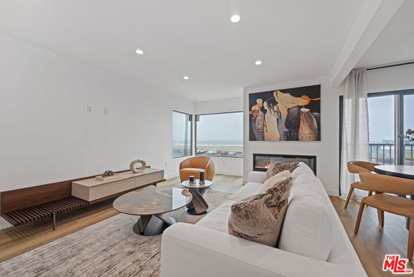 Dining room, Fireplace, Interior, Living room, Recessed Lighting, Water, Wood Texture Flooring