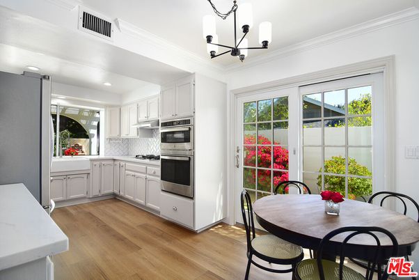 Chandelier, Dining room, Interior, Kitchen, Pendant Lights, Recessed Lighting, Stainless Steel Appliances, Wood Texture Flooring