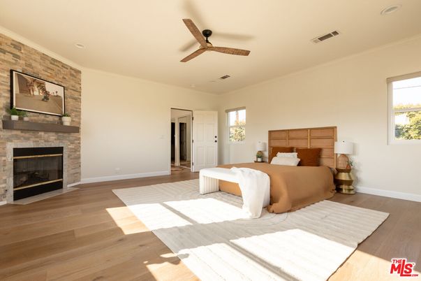 Bedroom, Fireplace, Interior, Recessed Lighting, Stone Walls, Wood Texture Flooring