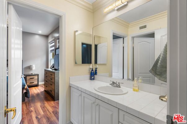 Bathroom, Dual Sink Vanities, Interior, Recessed Lighting, Tile Countertops, Wood Texture Flooring