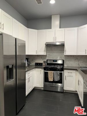 Interior, Kitchen, Marble Walls, Recessed Lighting, Stainless Steel Appliances