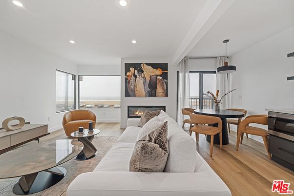 Dining room, Fireplace, Interior, Living room, Pendant Lights, Recessed Lighting, Water, Wood Texture Flooring