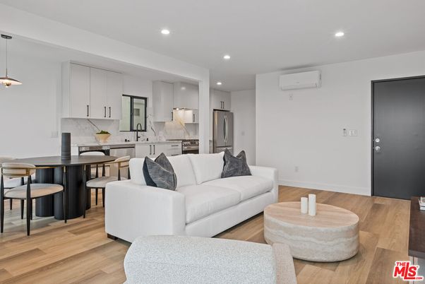 Dining room, Interior, Kitchen, Living room, Pendant Lights, Recessed Lighting, Stainless Steel Appliances, Wood Texture Flooring