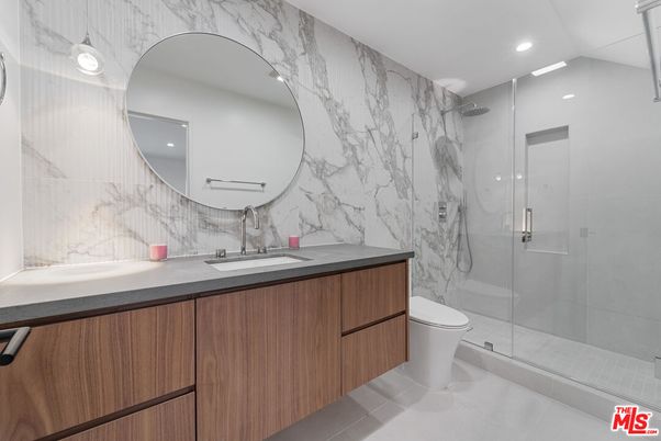 Bathroom, Dual Sink Vanities, Glass Shower, Interior, Marble Walls, Recessed Lighting