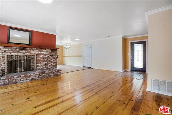 Empty room, Fireplace, Interior, Recessed Lighting, Stone Walls, Wood Texture Flooring
