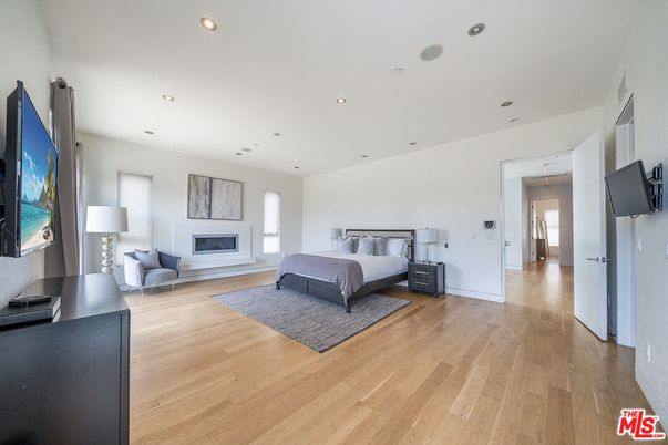 Bedroom, Fireplace, Interior, Recessed Lighting, Wood Texture Flooring