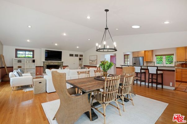 Chandelier, Dining room, Fireplace, Interior, Kitchen, Living room, Pendant Lights, Recessed Lighting, Stainless Steel Appliances, Wood Texture Flooring