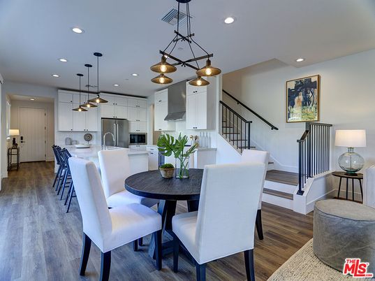 Dining room, Interior, Kitchen, Pendant Lights, Recessed Lighting, Stainless Steel Appliances, Wood Texture Flooring
