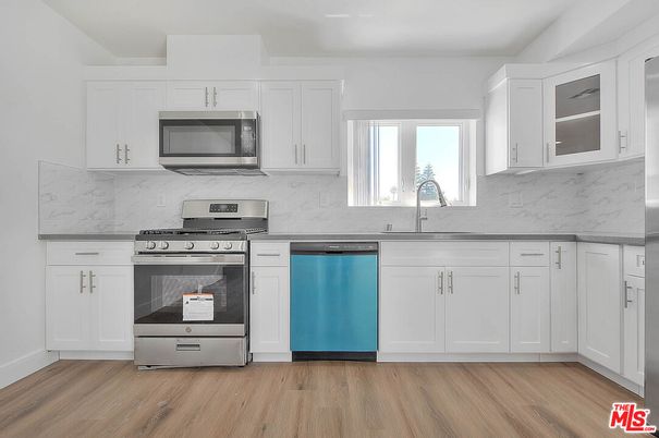 Interior, Kitchen, Marble Walls, Stainless Steel Appliances, Wood Texture Flooring