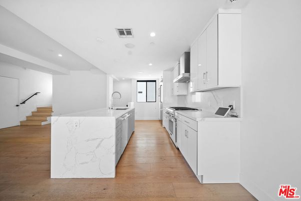 Interior, Kitchen, Marble Walls, Recessed Lighting, Wood Texture Flooring