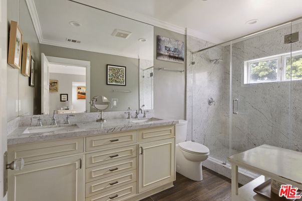 Bathroom, Dual Sink Vanities, Glass Shower, Interior, Marble Walls, Recessed Lighting, Wood Texture Flooring