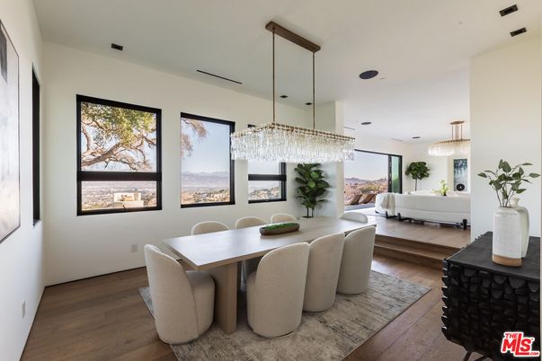 Chandelier, Dining room, Fireplace, Interior, Living room, Pendant Lights, Recessed Lighting, Wood Texture Flooring