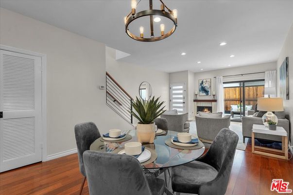 Chandelier, Dining room, Fireplace, Interior, Living room, Recessed Lighting, Wood Texture Flooring