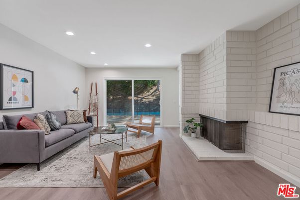 Fireplace, Interior, Living room, Recessed Lighting, Stone Walls, Wood Texture Flooring