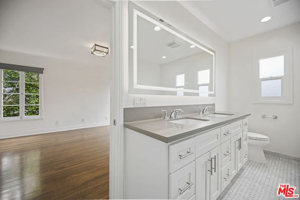 Bathroom, Dual Sink Vanities, Interior, Recessed Lighting, Wood Texture Flooring