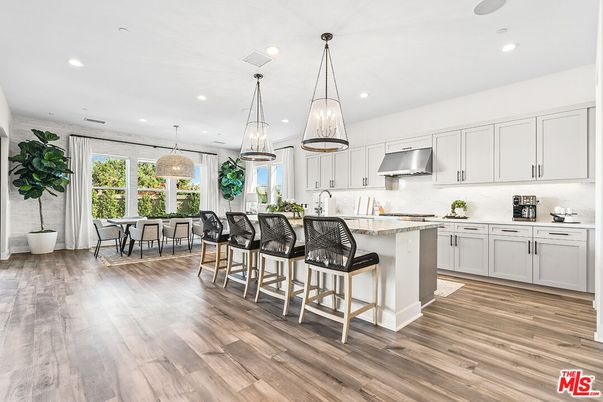 Dining room, Interior, Kitchen, Pendant Lights, Recessed Lighting, Stainless Steel Appliances, Wood Texture Flooring