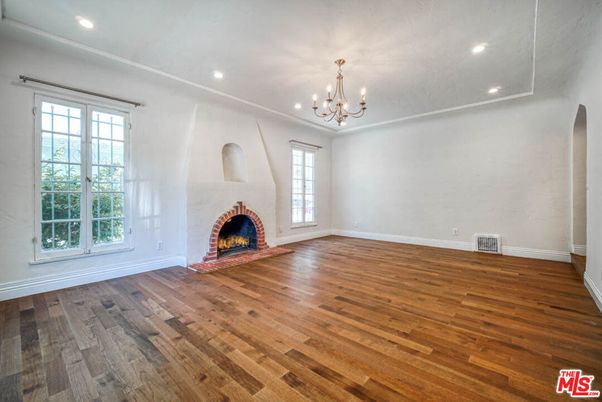 Chandelier, Empty room, Fireplace, Interior, Recessed Lighting, Wood Texture Flooring