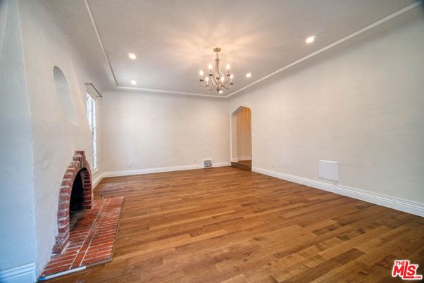Chandelier, Empty room, Fireplace, Interior, Recessed Lighting, Wood Texture Flooring