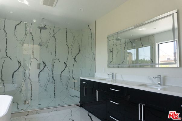 Bathroom, Dual Sink Vanities, Glass Shower, Interior, Marble, Marble Walls, Recessed Lighting