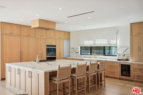 Interior, Kitchen, Marble Walls, Recessed Lighting, Stainless Steel Appliances, Wood Texture Flooring