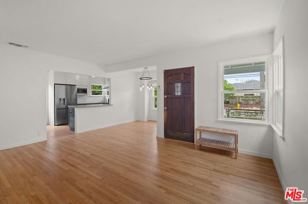 Empty room, Interior, Kitchen, Pendant Lights, Stainless Steel Appliances, Wood Texture Flooring
