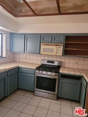 Interior, Kitchen, Stainless Steel Appliances, Tile Countertops