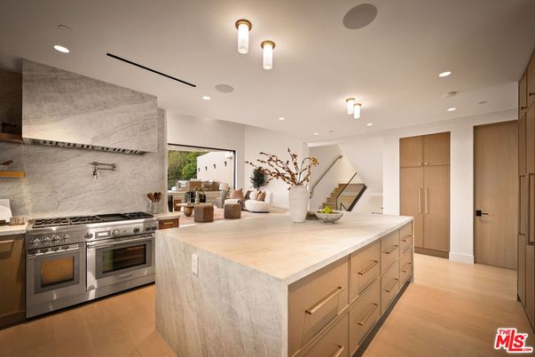 Interior, Kitchen, Marble Walls, Recessed Lighting, Stainless Steel Appliances, Wood Texture Flooring