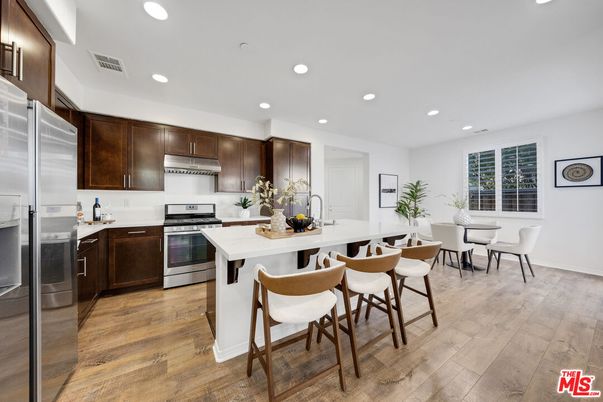 Dining room, Interior, Kitchen, Recessed Lighting, Stainless Steel Appliances, Wood Texture Flooring