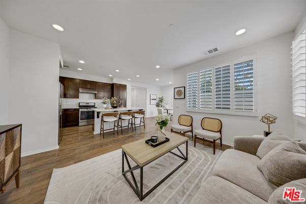 Dining room, Interior, Kitchen, Living room, Recessed Lighting, Stainless Steel Appliances, Wood Texture Flooring