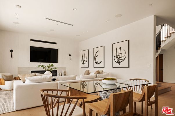 Dining room, Fireplace, Interior, Living room, Recessed Lighting, Wood Texture Flooring