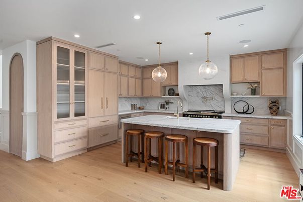 Interior, Kitchen, Marble Walls, Pendant Lights, Recessed Lighting, Stainless Steel Appliances, Wood Texture Flooring