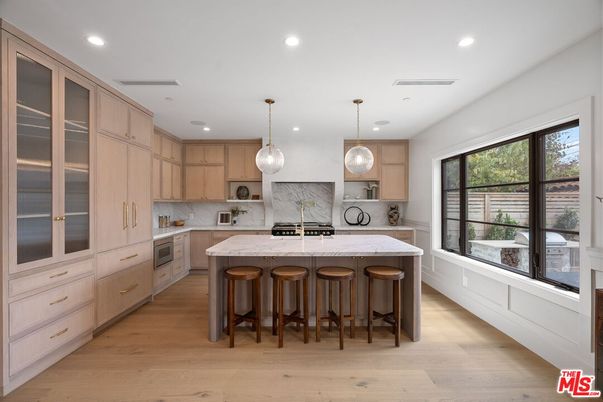 Interior, Kitchen, Marble Walls, Pendant Lights, Recessed Lighting, Stainless Steel Appliances, Wood Texture Flooring