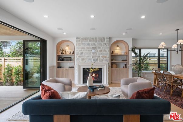 Chandelier, Dining room, Fireplace, Interior, Living room, Recessed Lighting, Stone Walls, Wood Texture Flooring