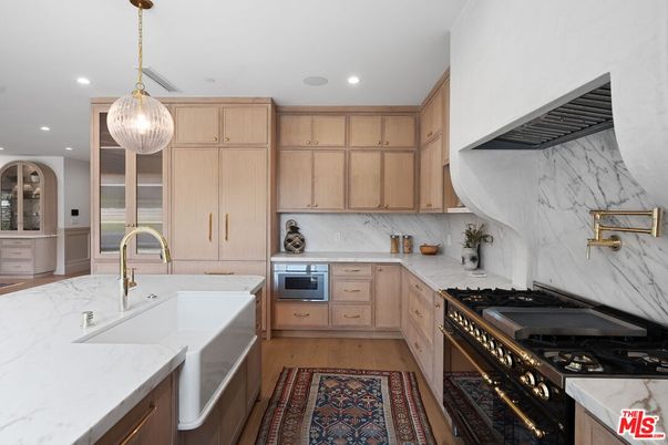 Interior, Kitchen, Marble Walls, Pendant Lights, Recessed Lighting, Stainless Steel Appliances, Wood Texture Flooring