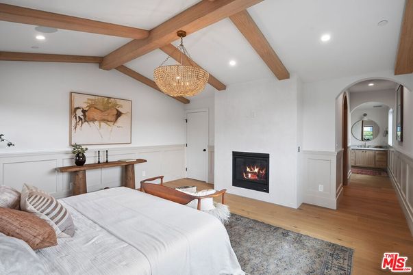 Bedroom, Chandelier, Fireplace, Interior, Recessed Lighting, Wooden Beams, Wood Texture Flooring