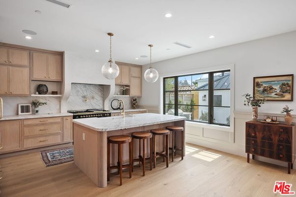 Interior, Kitchen, Marble Walls, Pendant Lights, Recessed Lighting, Stainless Steel Appliances, Wood Texture Flooring