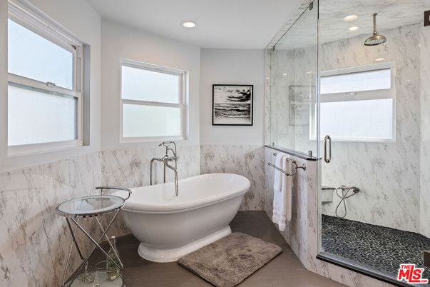 Bathroom, Free Standing Baths, Glass Shower, Interior, Marble Walls, Recessed Lighting, Wood Texture Flooring