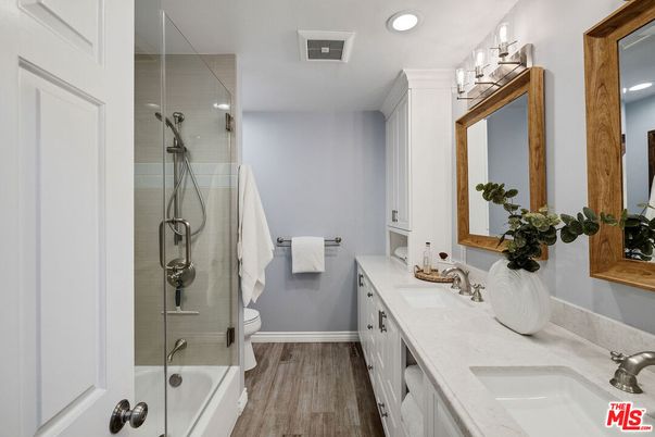 Bathroom, Dual Sink Vanities, Glass Shower, Interior, Recessed Lighting, Wood Texture Flooring