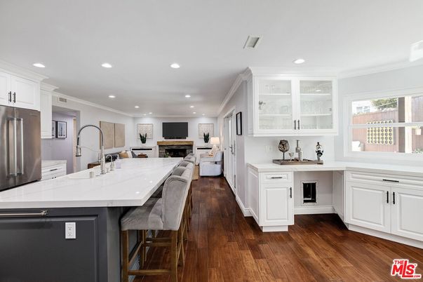 Fireplace, Interior, Kitchen, Recessed Lighting, Stainless Steel Appliances, Wood Texture Flooring