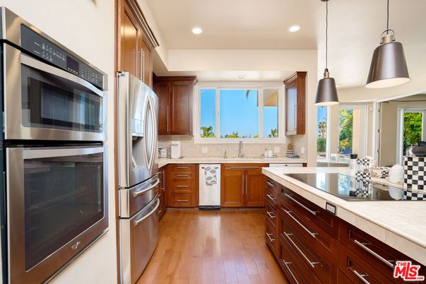 Interior, Kitchen, Pendant Lights, Recessed Lighting, Stainless Steel Appliances, Tile Countertops, Wood Texture Flooring