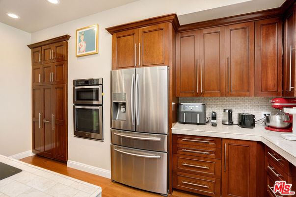 Interior, Kitchen, Recessed Lighting, Stainless Steel Appliances, Tile Countertops, Wood Texture Flooring