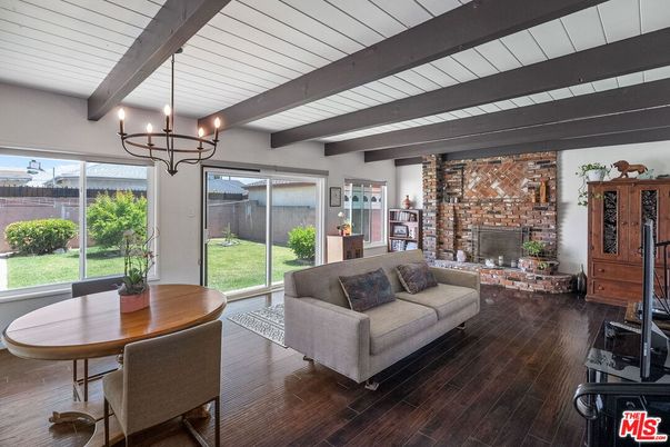 Chandelier, Dining room, Fireplace, Interior, Living room, Stone Walls, Wooden Beams, Wood Texture Flooring