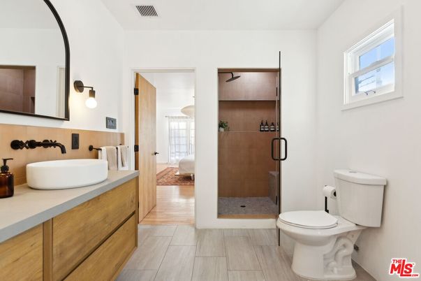 Bathroom, Dual Sink Vanities, Glass Shower, Interior, Wood Texture Flooring