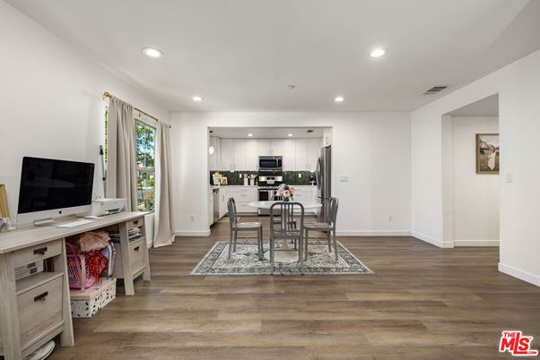 Dining room, Interior, Kitchen, Pendant Lights, Recessed Lighting, Stainless Steel Appliances, Wood Texture Flooring