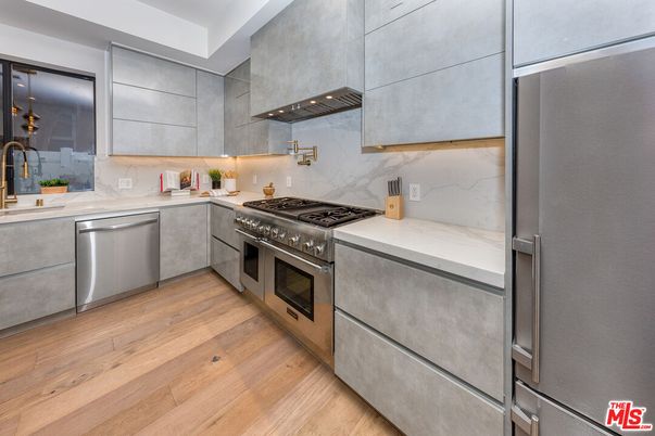 Interior, Kitchen, Marble Walls, Stainless Steel Appliances, Wood Texture Flooring