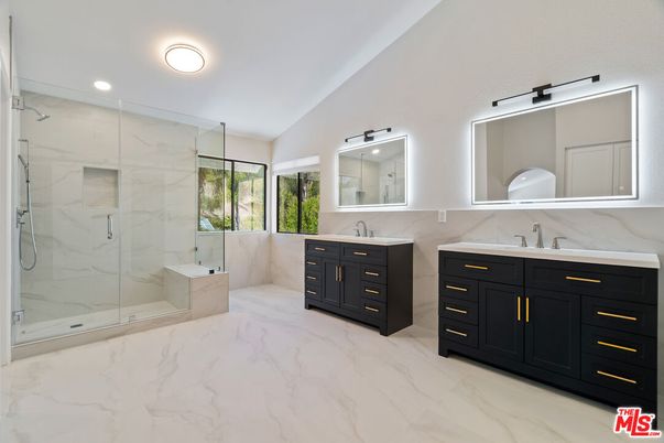 Bathroom, Dual Sink Vanities, Glass Shower, Interior, Marble, Marble Walls, Recessed Lighting