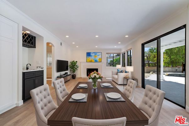 Dining room, Fireplace, Interior, Living room, Recessed Lighting, Wood Texture Flooring