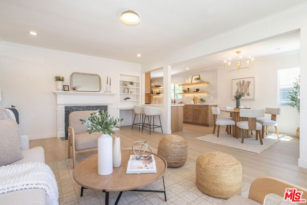 Chandelier, Dining room, Fireplace, Interior, Living room, Pendant Lights, Recessed Lighting, Wood Texture Flooring