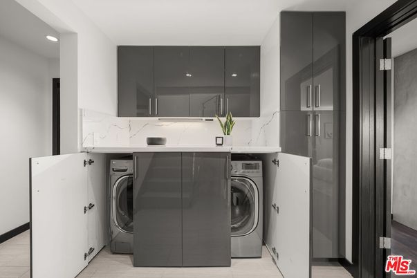 Interior, Kitchen, Marble Walls, Recessed Lighting, Washer, Wood Texture Flooring