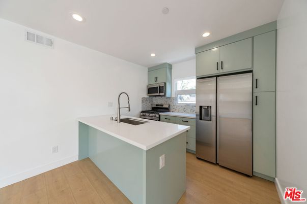 Interior, Kitchen, Recessed Lighting, Stainless Steel Appliances, Wood Texture Flooring